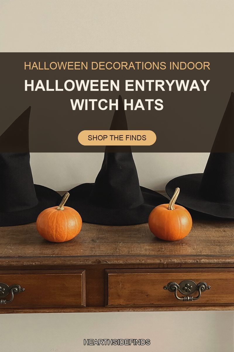 Three black felt witch hats on a dark wood console with brass pulls, two orange pumpkins in front.