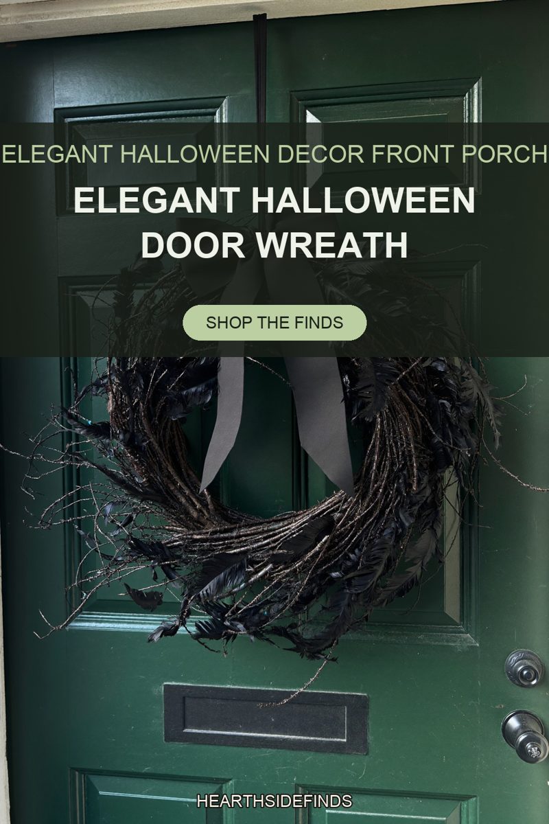 Wreath of dark twigs and black feathers with a wide black bow on a deep green paneled front door.