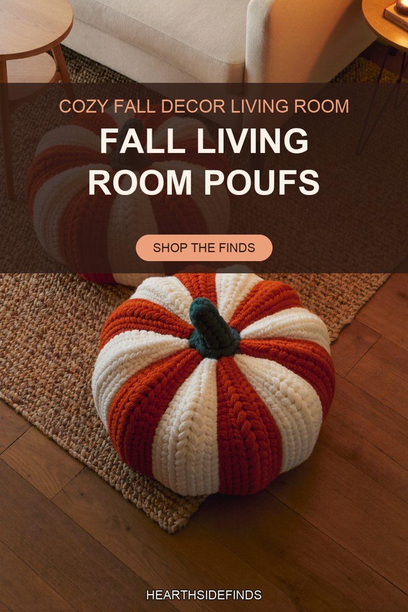 Two chunky knit pumpkin poufs in orange and cream with teal stems on a jute rug beside a cream sofa.