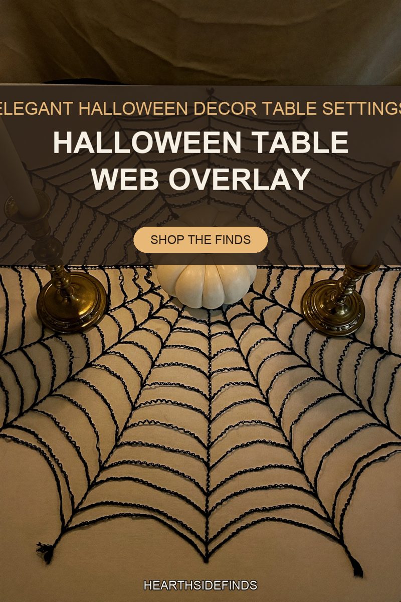Black crocheted spiderweb overlay on a cream tablecloth with a white pumpkin and two brass candlesticks.