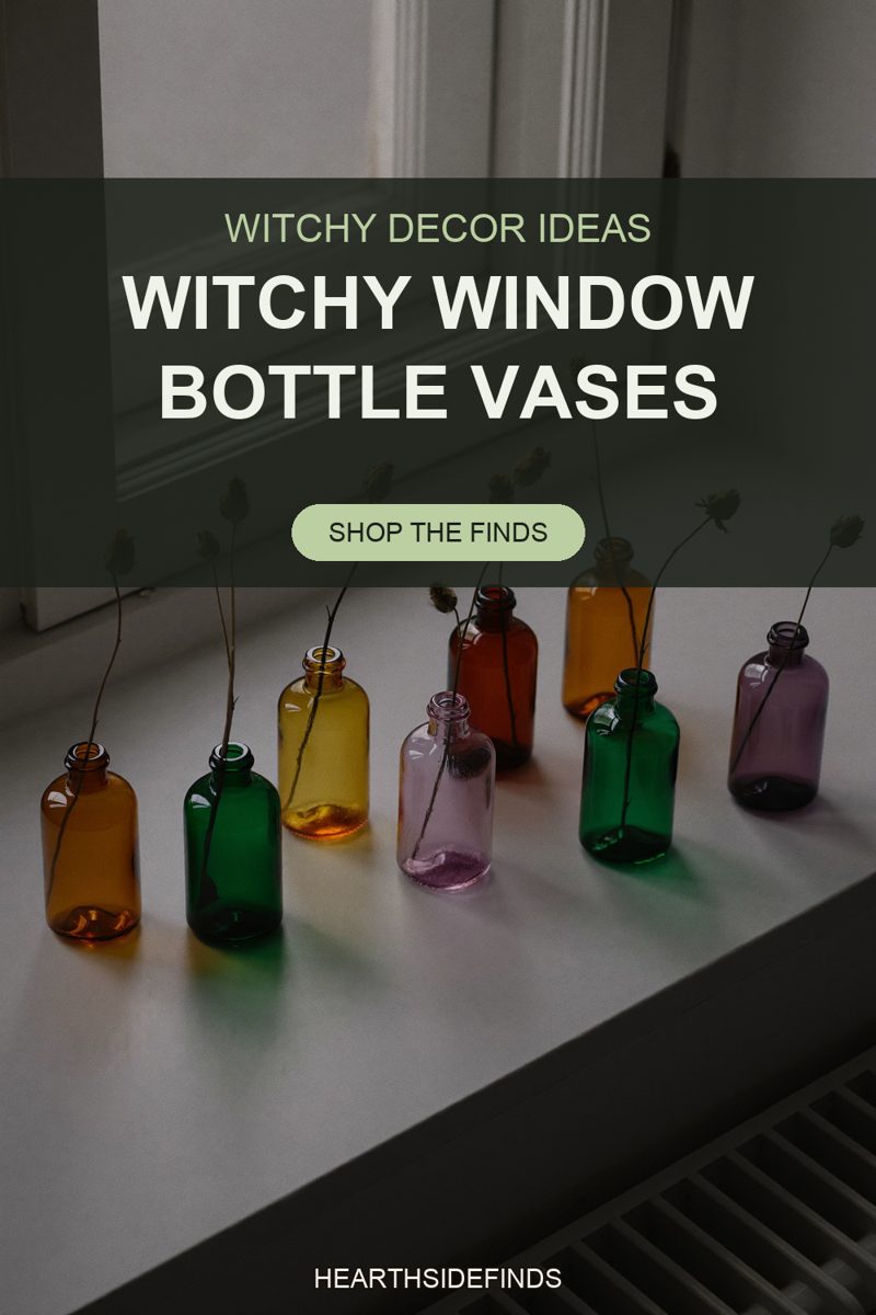 Eight amber, green, yellow, pink and purple glass bottles each holding a dried thistle stem on a white sill.